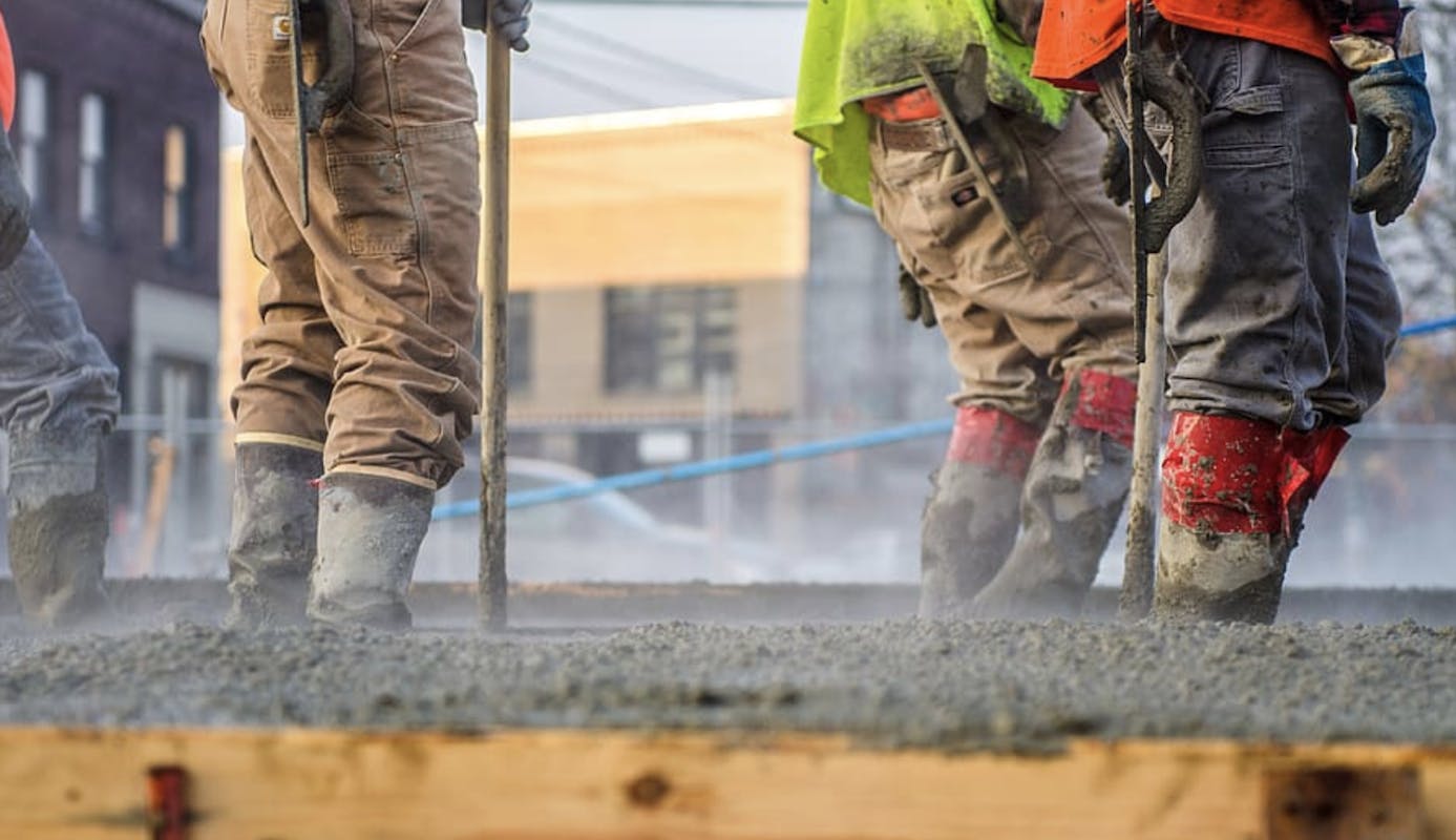 66fdb91ea5dba01edd4616cd Pouringconcretefoundationforhouseworkersstandingin