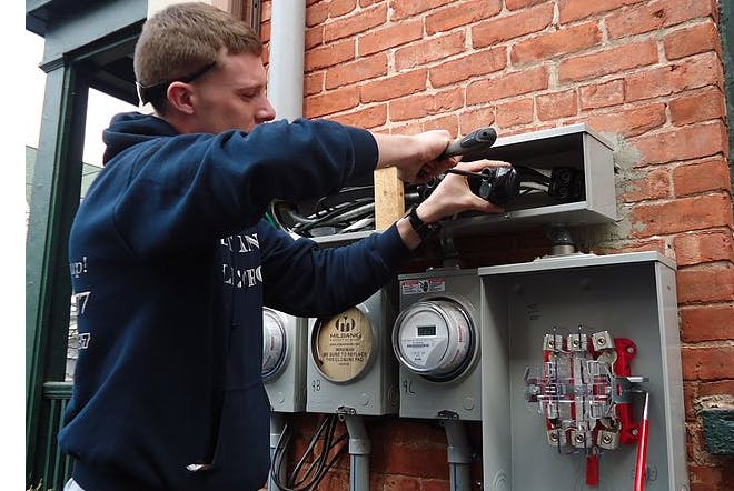 66fdb9473cabd9667aa68d81 Electrician20installing20outdoor20connections20on2