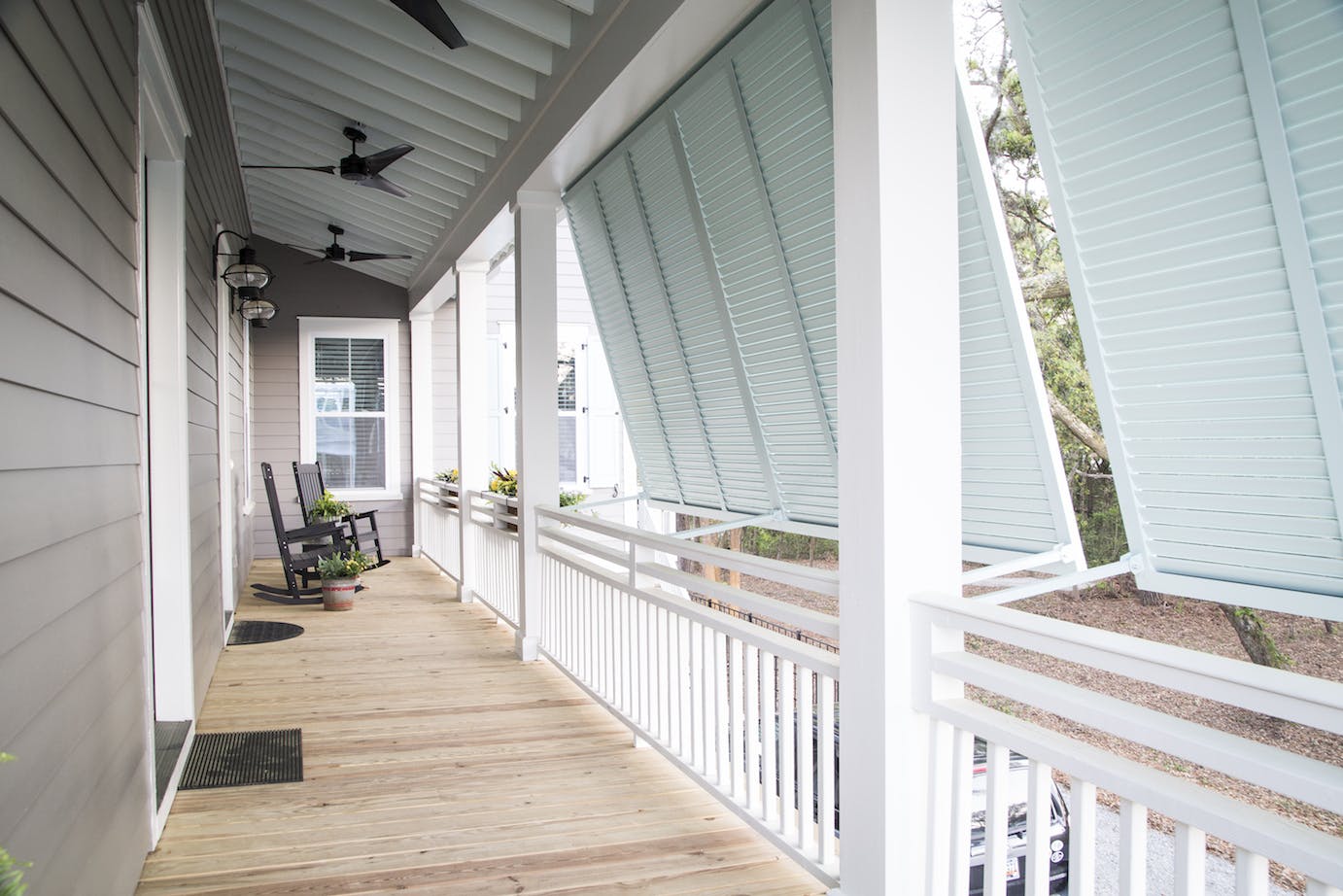 Gabled roofs and big porches are common to the farmhouse. Today's modern versions, like the Creekside at Freeman's Point by FrontDoor Communities, in Charleston, S.C., draw on those features while modifying the home for its region. |