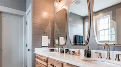 Luxurious showers, soaking tubs, and water-conserving fixtures are on-trend in the bathroom. Photo: courtesy Garman Homes