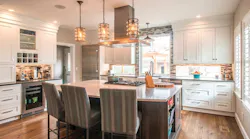 Pendants, recessed downlights, under-cabinet fixtures, and big windows light up this kitchen. Project: Consolidated Construction Management, BKC Kitchens & Baths, Doug Walter Architects. | Photo: Philip Wegener Photography