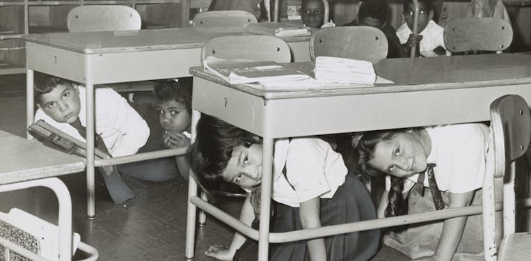 66fdb9f755d39705b5096ef0 Children Huddle Under Desks