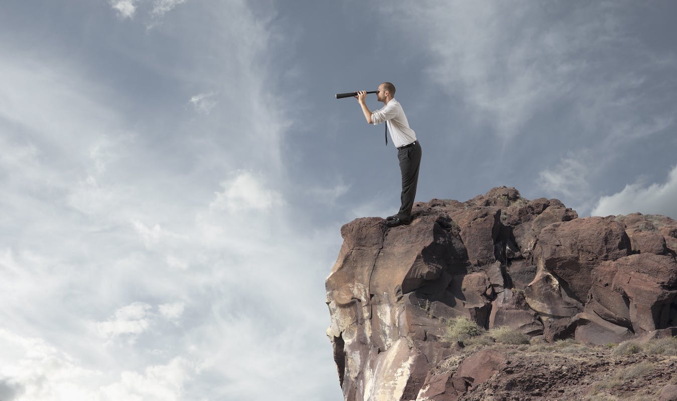 66fdba1dd4ea3860f7a58d25 Manonclifflookingthroughspyglasstoseefuture