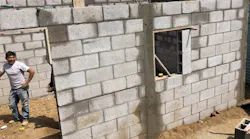 Putting up the concrete-block walls of the Xicon family's home in Guatemala. | Photos: courtesy The 141 Project