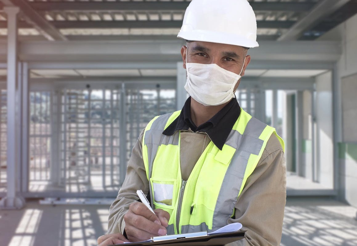 66fdba7701d3bf22a8af6d8a Constructionworkerwearingprotectivefacemaskonjobsi