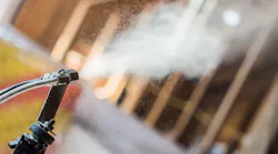 Aerosol whole-building envelope sealing is high-tech process that uses a dry fog of aerosol sealant and pressurization from the blower door test setup to find and seal leaks. | Photo: courtesy Building America Program