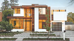 Striving to maintain a sense of personal history while meeting the needs of a 21st-century family, architect Donald Ruthroff, AIA, combined time-tested and new elements to create a modern version of the client’s childhood home. “The clean lines and strong street presence are clearly indicative of contemporary design,” Ruthroff says. “But we also worked to make it feel warm by incorporating natural wood elements that connect the structure to the outdoors,” including a magnolia tree planted by the client’s parents.