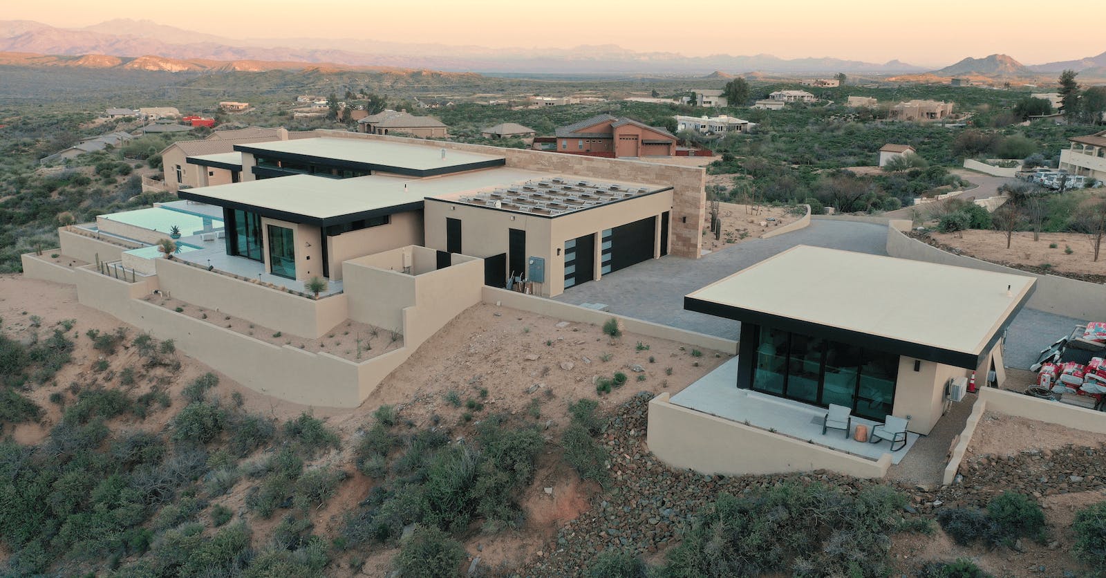 The Desert Comfort Idea Home, including a detached casita, achieves net-zero energy use, indoor comfort and health, and resilience in a harsh desert climate. | Photo: Alex LaLiberte