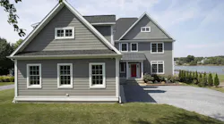 The large gables on this farmhouse-style home lend themselves to relying on texture, not color, to add eye-catching variation without overwhelming the façade. Shown are Chester Celect 7” Clapboard and Celect 7” Shake, both in Shale