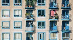Apartment Building Exterior Blue Window Frames Balconies
