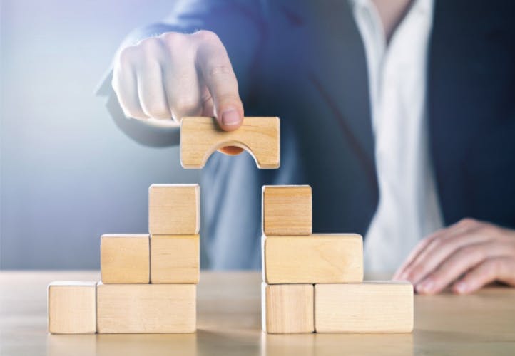 66fdbc7ce63fdc7b97457ec5 A20hand20stacking20building20blocks