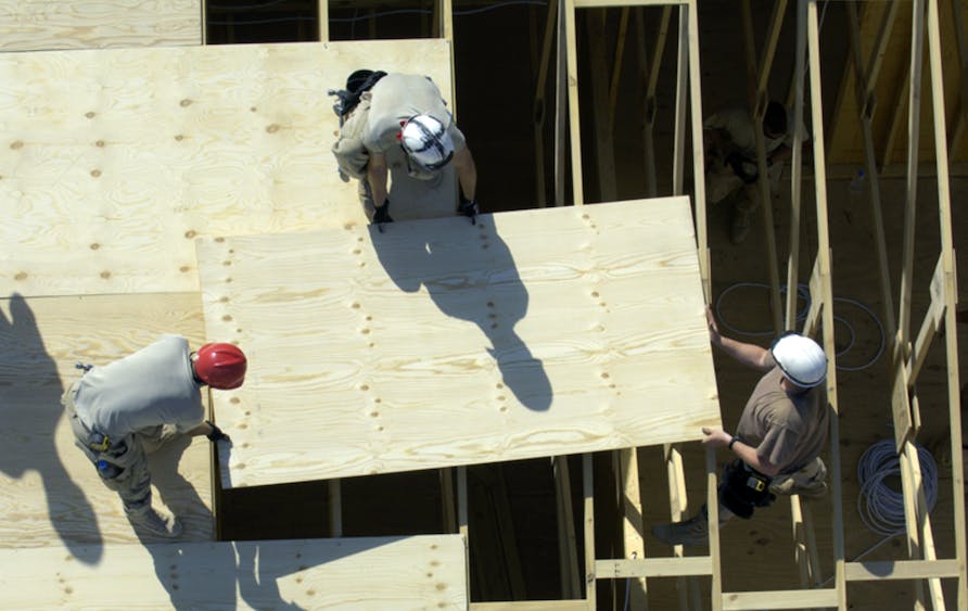 66fdc0253cabd9b0f8a69fa3 Construction20workers20with20plywood