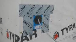 Because it easily integrates into the drainage plane, the best option for flashing penetrations is to use a manufactured flashing panel with a rubberized gasket and flash it on three sides with flashing tape. (Photo: IBACOS)