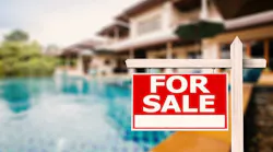 for sale sign at luxury house with pool background By phonlamaiphoto - Adobe Stock