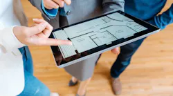 Realtor explaining floor plan to couple buying a house By Kzenon - Adobe Stock