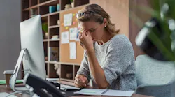 Business woman having headache at office By Rido - Adobe Stock