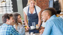 Waitress serving at table By Rido - Adobe Stock