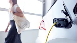 Woman Going Shopping Whilst Leaving Electric Vehicle To Charge In Car Park By Monkey Business - Adobe Stock