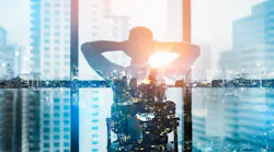 Business young man relax after work of office window with business district view. See Less By yingyaipumi - Adobe Stock