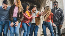 group of millennials having fun walking in the city in the morning. By G. Lombardo - Adobe Stock