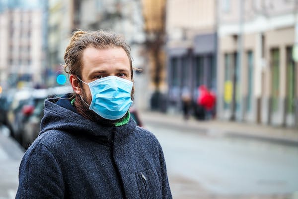 66fdc6573cabd96818a6a856 Manwearingmasktoprotectagainstcoronavirus