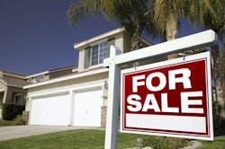 Single-family home with a 'for sale' sign in the front yard Single-family home with a 'for sale' sign in the front yard