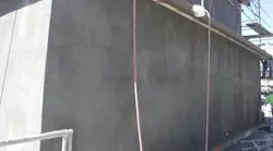 The scratch coat must be applied to an entire wall or ceiling panel without interruption to avoid cold joints and abrupt changes in the uniform appearance of succeeding coats. The scratch coat must extend to the top of the wall. | Photo: courtesy IBACOS