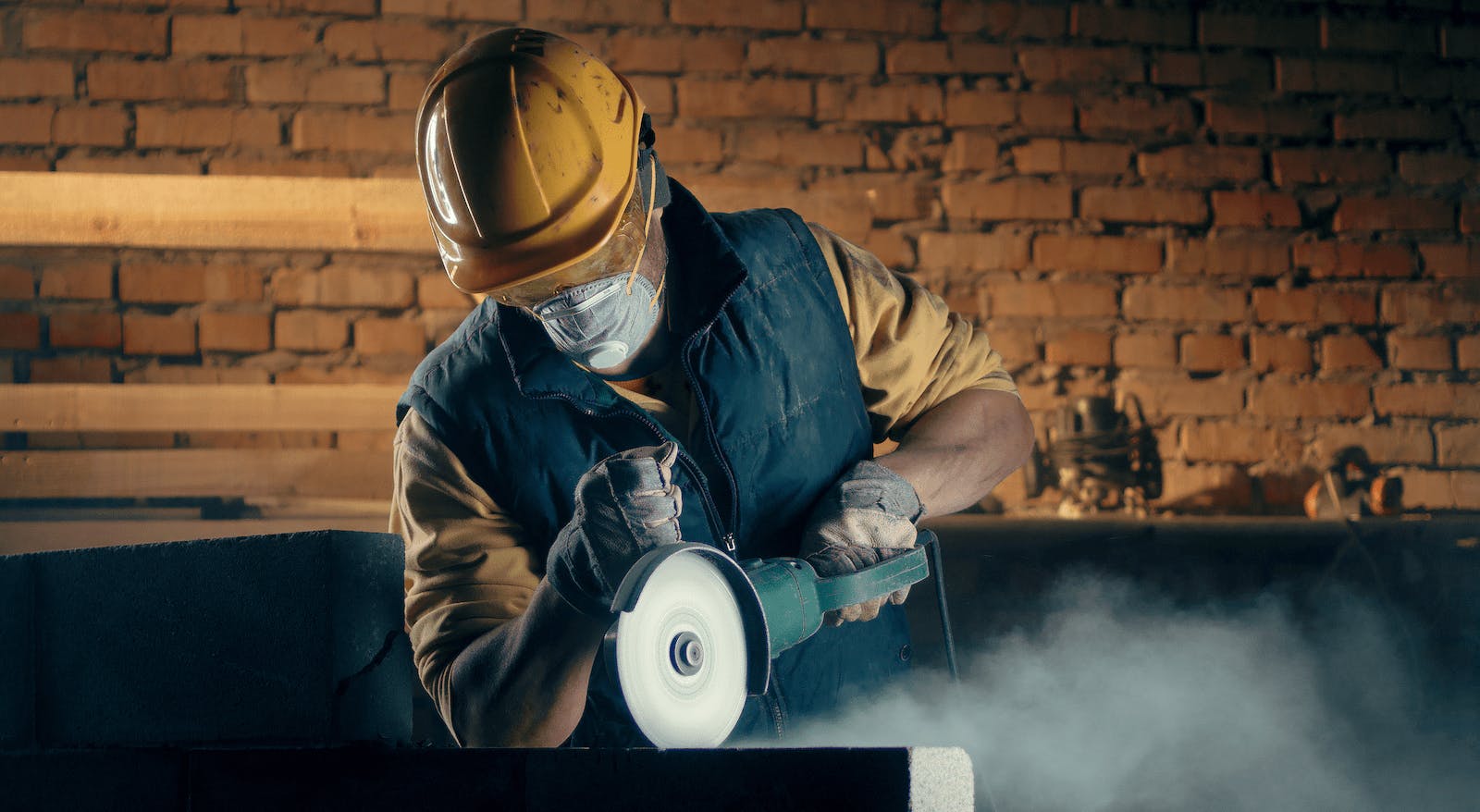 66fdca4be63fdcc5b3459bf6 Constructionworkerwearing20ppecuttingconcretemin