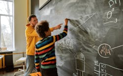 66fdcaaca5dba03510463b45 Teacheratblackboardwithstudentmin 66fdcaaca5dba03510463b45 Teacheratblackboardwithstudentmin