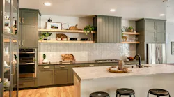 This kitchen by Pardee Homes contains lots of storage, mixed metals, and distinct cabinetry and island. Photo courtesy Tri Pointe Homes