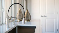A hands-free touch kitchen faucet ranks in homebuyers' most valued features, alongside other smart devices. Photo courtesy Tri Pointe Homes