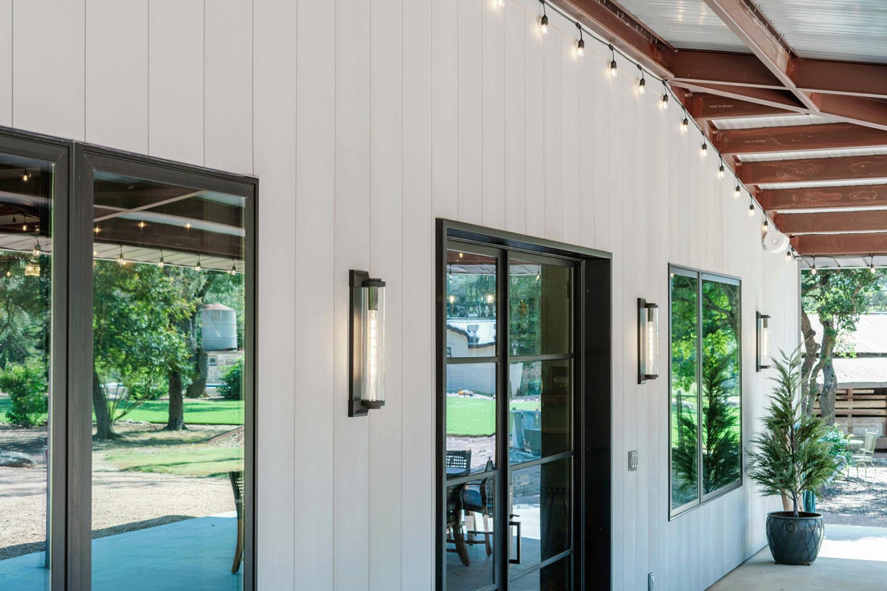 When replacing exotic hardwoods such as Ipe, one pallet of Acre saves an acre of tropical rainforest, according to the report. Pictured: The Austin Barn vertical siding using Acre sheets. Photo courtesy Modern Mill
