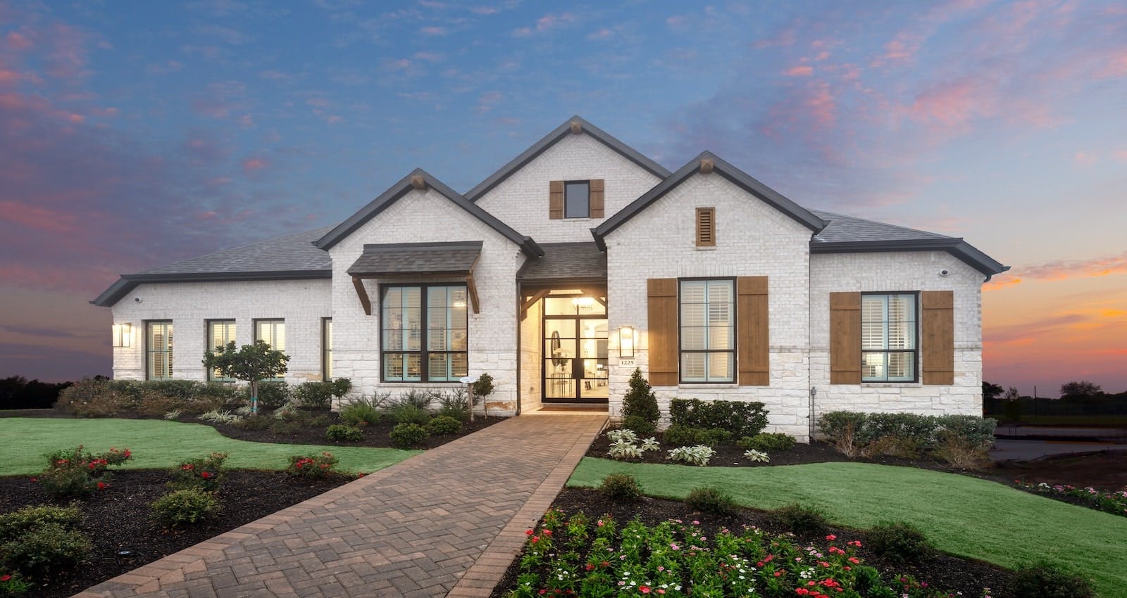 During 2022, the time it took Highland Homes to construct a home extended from about 150 days to perhaps 250 days, with costs rising due to supply chain issues and labor shortages, causing the company to rethink and revise its strategy. Shown: Elevation C of the Turin model in Leander, Tex.