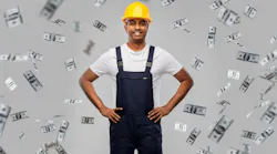 Construction worker wearing yellow hard hat with US dollars raining down around him