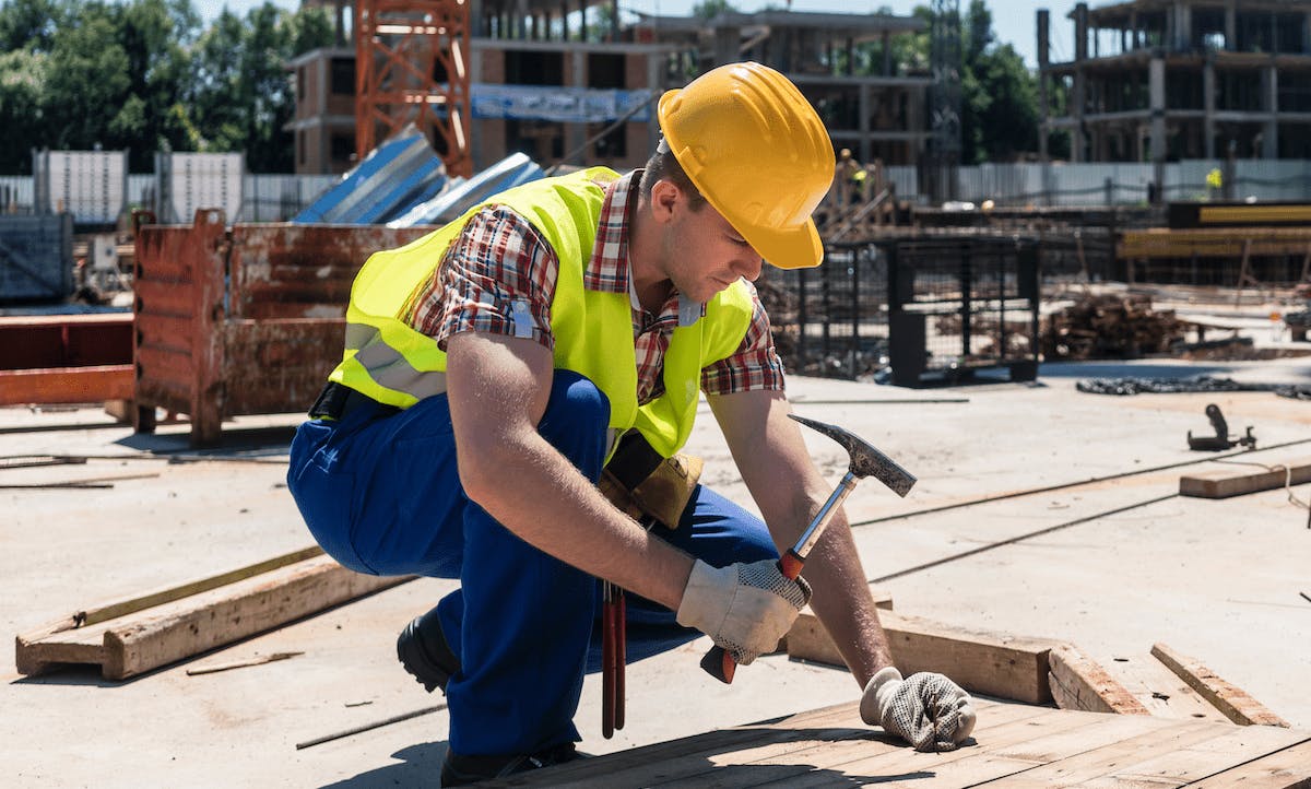 66fdd067a897b56934b21fb4 Constructionworkerhammeringnailintoboardmin