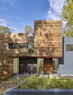 Exterior view of front entry showing staircase that separates master bedroom and children's wings Exterior view of front entry showing staircase that separates master bedroom and children's wings