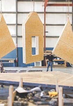 Gable walls on a hoist, Champion Homes factory Gable walls on a hoist, Champion Homes factory