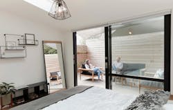 2019 Professional Builder Design Awards Gold Infill bedroom with access to outdoor patio 2019 Professional Builder Design Awards Gold Infill bedroom with access to outdoor patio
