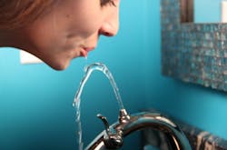 Nasoni Fontanina faucet with woman drinking Nasoni Fontanina faucet with woman drinking