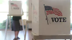 Voters cast their ballots at voting booths in US elections.