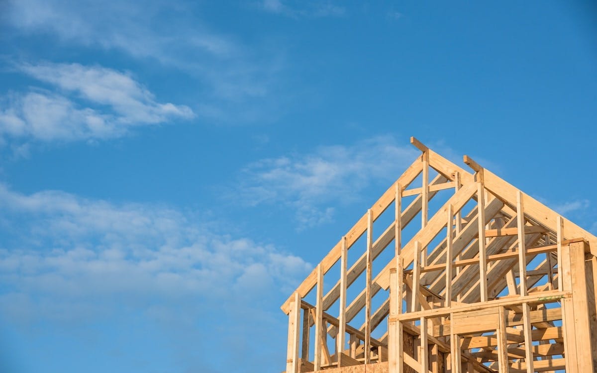 Framed home against blue sky