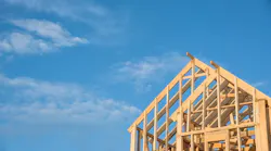 Framed home against blue sky