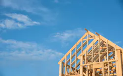 Framed home against blue sky