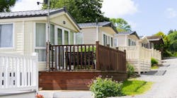 Row of single-level manufactured homes Row of single-level manufactured homes