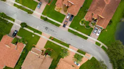 An aerial view of a suburban road