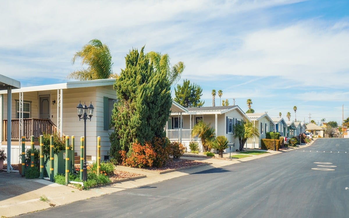 A row of manufactured houses on a suburban street