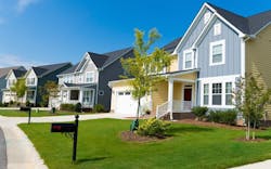 A row of new-construction homes in a residential neighborhood A row of new-construction homes in a residential neighborhood