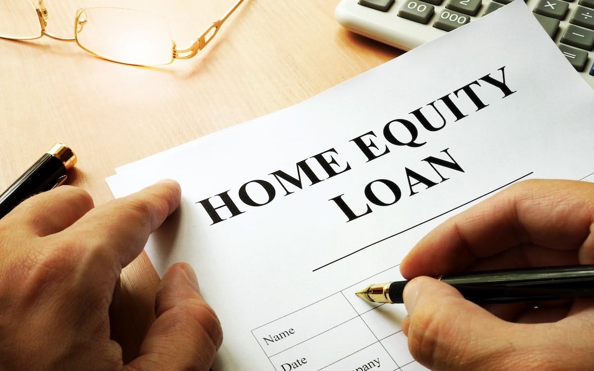 A homeowner signs a home equity loan