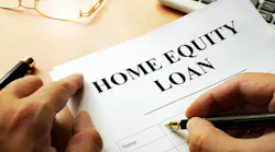 A homeowner signs a home equity loan
