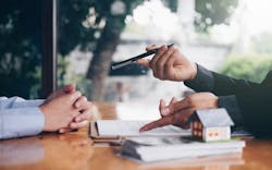 Real estate agent meets with a buyer to discuss the homebuying process Real estate agent meets with a buyer to discuss the homebuying process